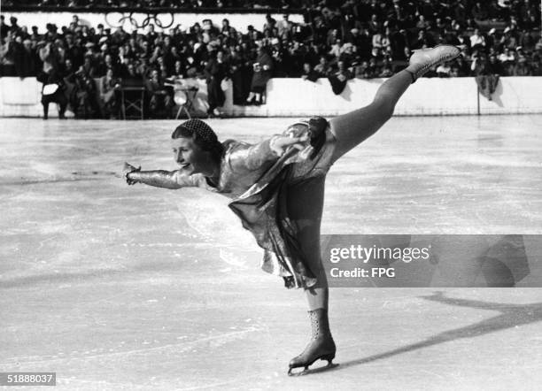 British figure skater Cecilia Colledge executes a spiral during the women's figure skating final at the 1936 Winter Olympic Games, where she won the...