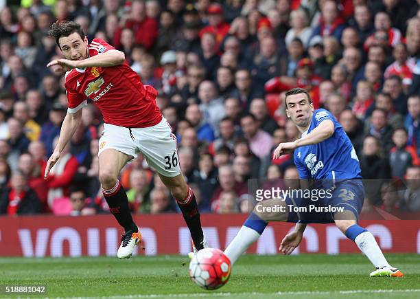 Matteo Darmian of Manchester United in action with Seamus Coleman of Everton during the Barclays Premier League match between Manchester United and...