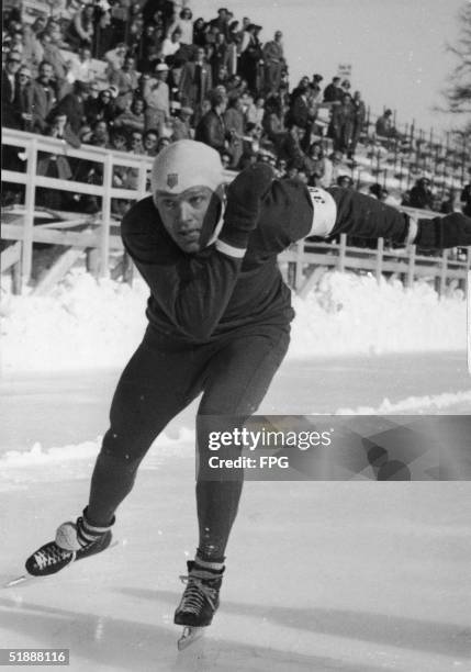 American speed skater Kenneth Bartholomew races down the track at the 1948 Winter Olympic Games, where he, US teammate Bobby Fitzgerald, and Thomas...