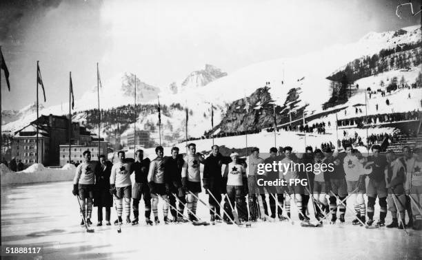 Members of the Canadian and Swedish Olympic hockey teams line up on an outdoor ice rink after the 1928 Winter Olympic Games, where the Canadian team...