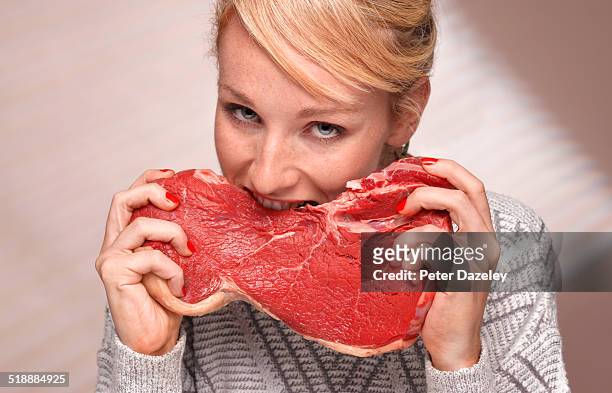 woman eating steak - binge eating stock pictures, royalty-free photos & images