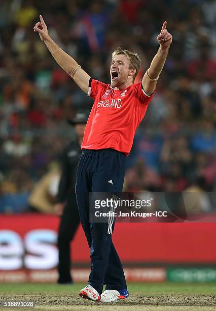 David Willey of England celebrates the wicket of Darren Sammy, Captain of the West Indies during the ICC World Twenty20 India 2016 final match...