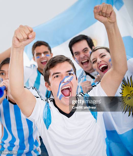 football fans cheering for argentina - argentina soccer stock pictures, royalty-free photos & images