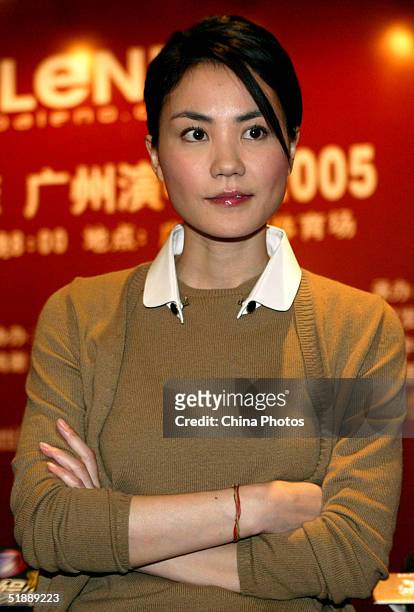 Chinese Star Faye Wong takes a question at a news conference on December 22, 2004 in Guangzhou, China. Wong will hold her concert in Guangzhou on...