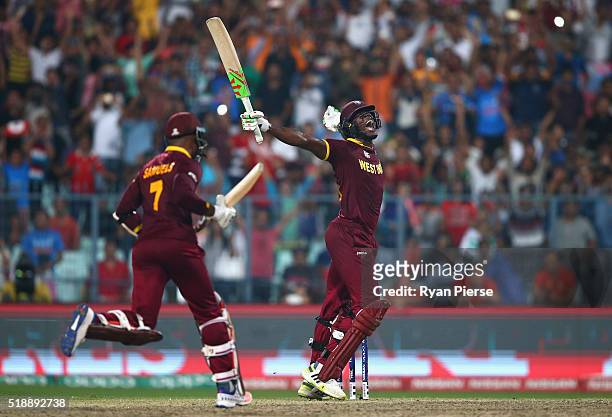 Carlos Brathwaite of the West Indies celebrates hitting the winning runs during the ICC World Twenty20 India 2016 Final match between England and...