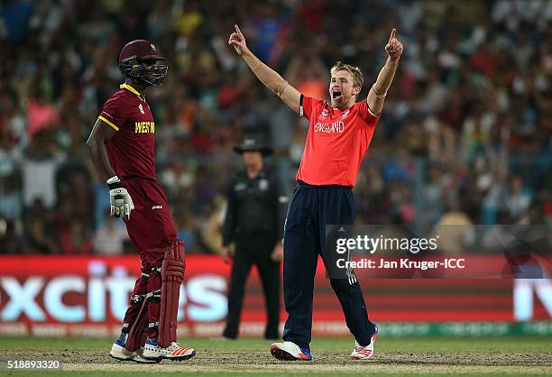 David Willey of England celebrates the wicket of Darren Sammy, Captain of the West Indies during the ICC World Twenty20 India 2016 final match...