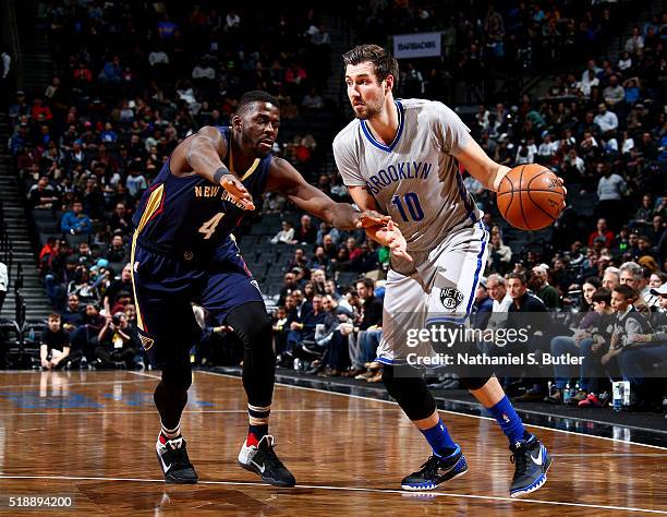 Sergey Karasev of the Brooklyn Nets handles the ball during the game against James Ennis of the New Orleans Pelicans on April 3, 2016 at Barclays...