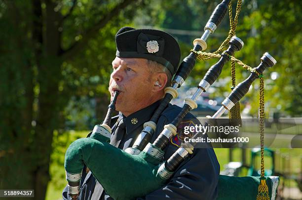 piper playing taps - memorial vigil stock pictures, royalty-free photos & images