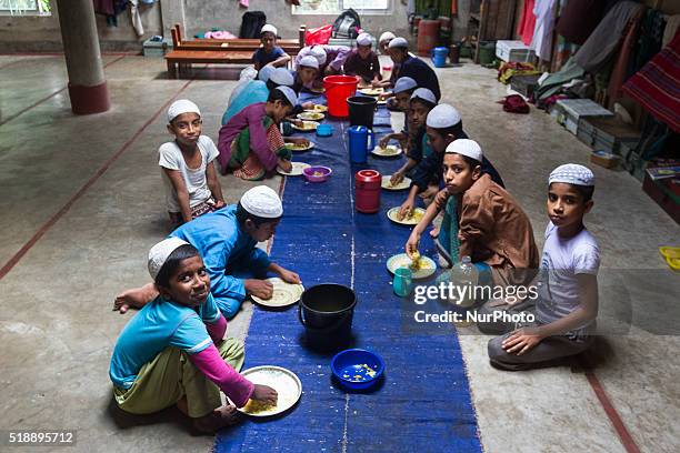 Madrasa students are having their lunch inside the Madrasa in Noakhali, Bangladesh, on April 3, 2016. Over the last few days in Bangladesh lots of...