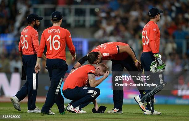 Ben Stokes of England is consoled by Liam Plunkett after losing the ICC World Twenty20 India 2016 Final between England and the West Indies at Eden...