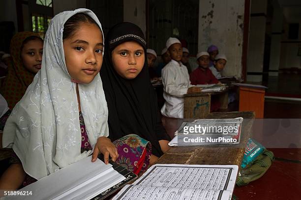 Young students both male and female are studying inside the Madrasa in Noakhali, Bangladesh, on April 3, 2016. Over the last few days in Bangladesh...