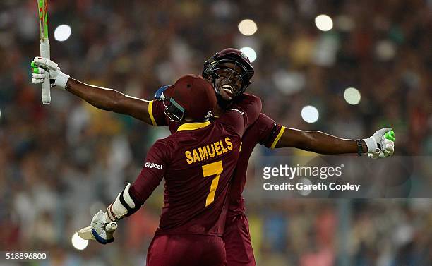 Carlos Brathwaite of the West Indies celebrates hitting the winning runs with Marlon Samuels to win the ICC World Twenty20 India 2016 Final between...