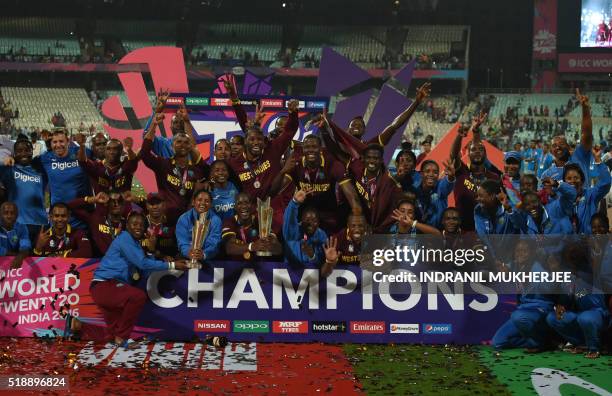 West Indies's cricketers celebrate after winning the World T20 cricket tournament final match between England and West Indies at The Eden Gardens...