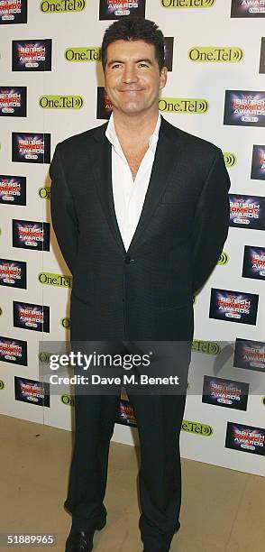 Presenter Simon Cowell arrives at the "British Comedy Awards 2004" at London Television Studios on December 22, 2004 in London. Jonathan Ross hosted...