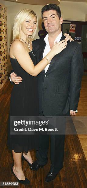 Presenters Kate Thornton and Simon Cowell arrive at the "British Comedy Awards 2004" at London Television Studios on December 22, 2004 in London....