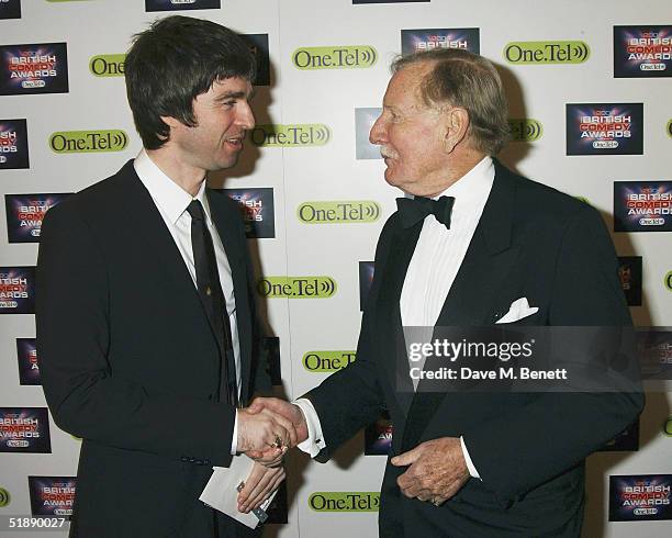 Musician Noel Gallagher and actor Leslie Phillips arrive at the "British Comedy Awards 2004" at London Television Studios on December 22, 2004 in...