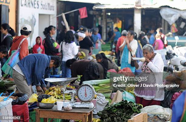 market stall at busy market, antigua, guatemala - antigua guatemala stock pictures, royalty-free photos & images