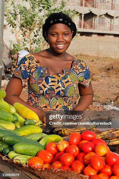 a young woman selling vegetable - bamako stock-fotos und bilder