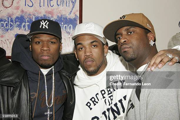 Members of G-Unit rappers 50 Cent, Lloyd Banks and Tony Yayo pose during the 2nd Annual Josh Evans/Book Bank Foundation Holiday Clothing Drive at the...