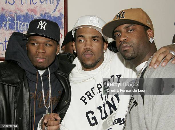 Members of G-Unit rappers 50 Cent, Lloyd Banks and Tony Yayo pose during the 2nd Annual Josh Evans/Book Bank Foundation Holiday Clothing Drive at the...