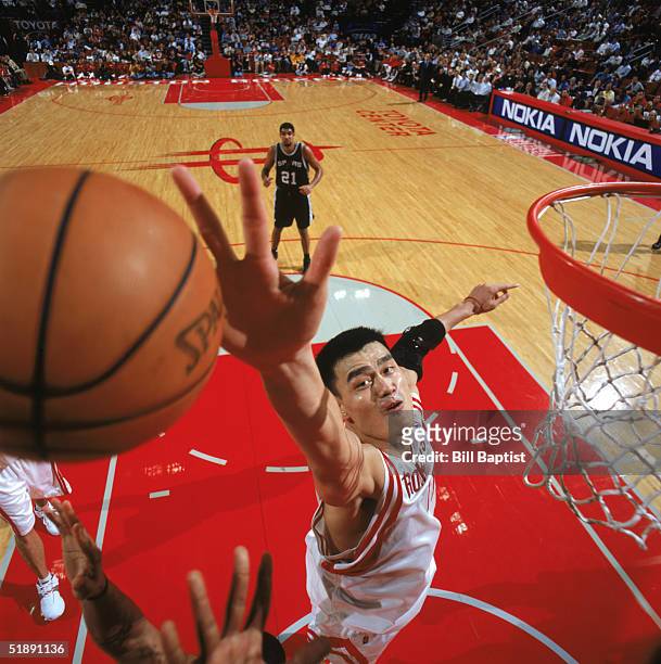 Yao Ming of the Houston Rockets moves for the ball against the San Antonio Spurs at Toyota Center on December 9, 2004 in Houston, Rockets. The...