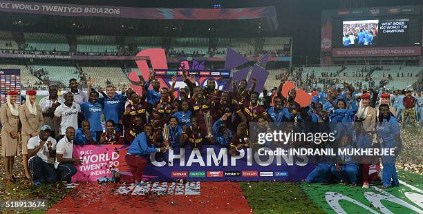 West Indies's men's and women's teams celebrate after their victories in the World T20 cricket tournament final match between England and West Indies...