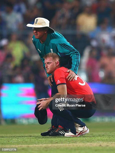 Ben Stokes of England and Trevor Bayliss, Head Coach of England, look on after West Indies hit the winning runs during the ICC World Twenty20 India...