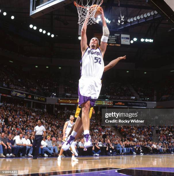 Brad Miller of the Sacramento Kings takes the ball to the basket during a game against the Indiana Pacers at Arco Arena on December 3, 2004 in...
