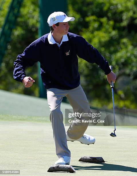 Ty Griggs reacts after sinking a putt on the way to winning the 12-13 Boys Drive, Chip and Putt Championship at Augusta National Golf Club on April...