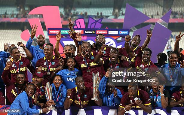 Darren Sammy, Captain of the West Indies and his team celebrate with the trophy during the ICC World Twenty20 India 2016 final match between England...