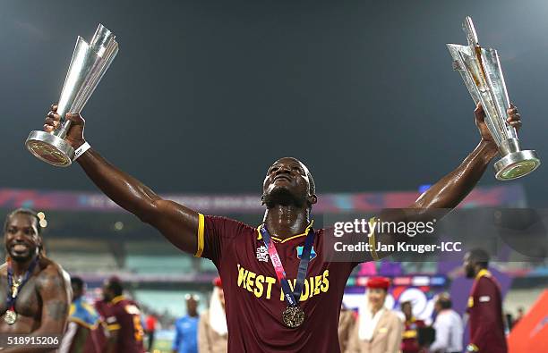 Darren Sammy, Captain of the West Indies celebrate with the trophy during the ICC World Twenty20 India 2016 final match between England and West...