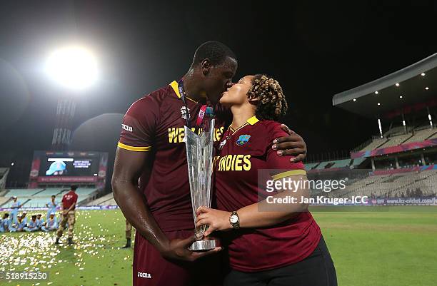 Carlos Brathwaite of the West Indies gets a kiss from his partner Jessica Felix during the ICC World Twenty20 India 2016 final match between England...