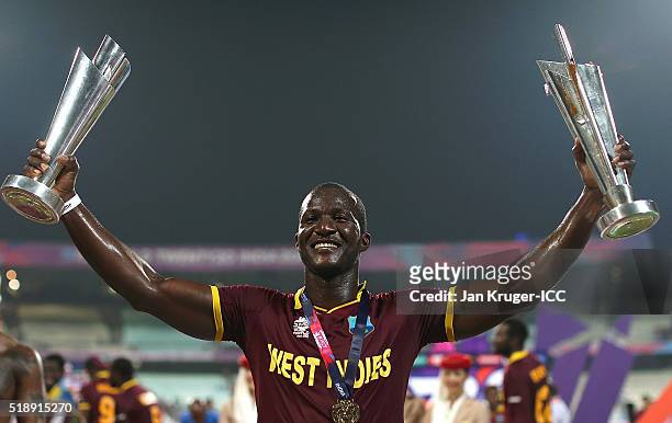Darren Sammy, Captain of the West Indies celebrate with the trophy during the ICC World Twenty20 India 2016 final match between England and West...