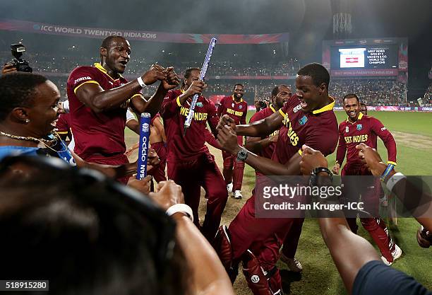 Darren Sammy, Captain of the West Indies and Carlos Brathwaite of the West Indies celebrate during the ICC World Twenty20 India 2016 final match...