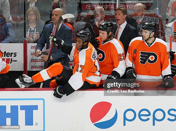 Assistant Coach Ian Laperriere, Wayne Simmonds, Ryan White, Head Coach Dave Hakstol and Chris VandeVelde of the Philadelphia Flyers react to the play...