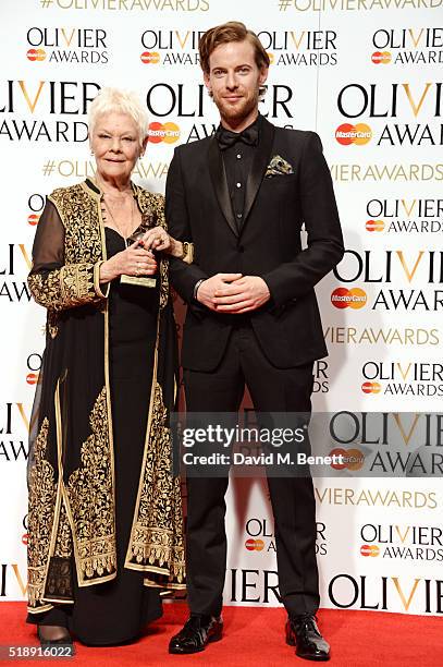 Dame Judi Dench , winner of the Best Actress In A Supporting Role award for "The Winter's Tale", and presenter Luke Treadaway pose in the Winners...