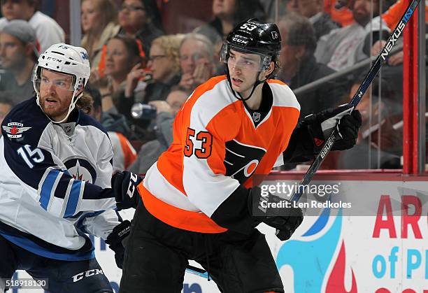 Shayne Gostisbehere of the Philadelphia Flyers skates against Matt Halischuk of the Winnipeg Jets on March 28, 2016 at the Wells Fargo Center in...