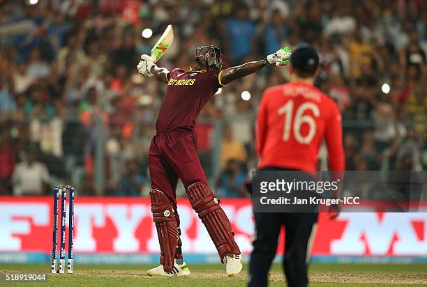 Carlos Brathwaite of the West Indies celebrates the winning runs during the ICC World Twenty20 India 2016 final match between England and West Indies...