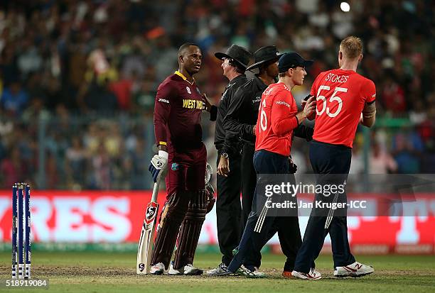 Marlon Samuels of the West Indies argues with Ben Stokes of England during the ICC World Twenty20 India 2016 final match between England and West...