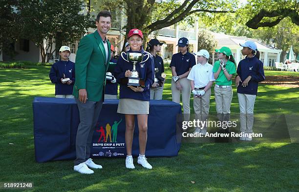 Adam Scott of Australia, former Masters champiion, presents Alexa Pano with her 10-11 Girls award during the Drive, Chip and Putt Championship at...