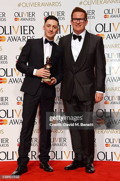 Drew McOnie, winner of the Best Theatre Choreographer award for "In The Heights", and presenter Sir Matthew Bourne pose in the Winners Room at The...