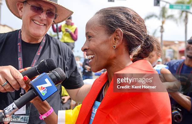 Meseret Defar of Ethiopia speaks with members of the media after finishing first in the Elite field at the Carlsbad 5000 on April 3, 2016 in...
