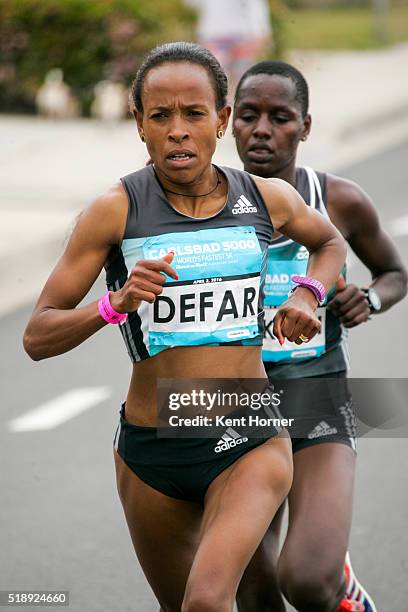 Meseret Defar of Ethiopia leads the race running in the Elite field at the Carlsbad 5000 on April 3, 2016 in Carlsbad, California.