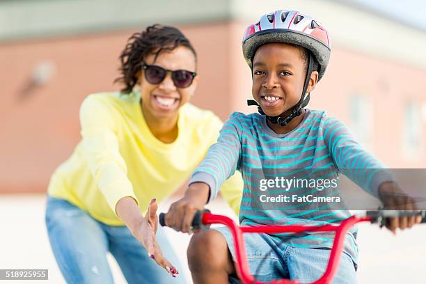 riding bike - black helmet stock pictures, royalty-free photos & images