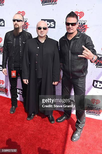 Musicians Mike Wengren, David Draiman and Dan Donegan attend the iHeartRadio Music Awards at The Forum on April 3, 2016 in Inglewood, California.