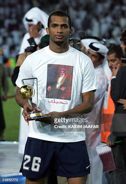 Ali al-Habsi of Oman displays his best goalkeeper trophy after the final match of the 17th Gulf Cup tournament in Doha 24 December 2004. Qatar won...