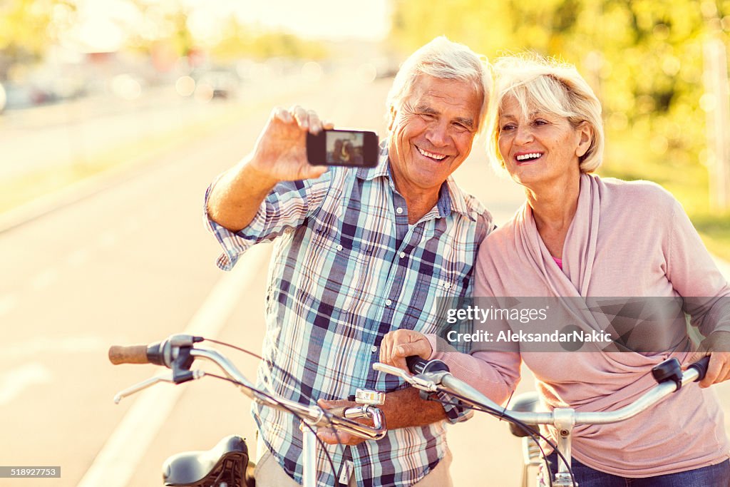 Smiling senior couple taking a selfie