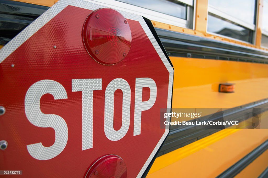 Stop sign on side of school bus