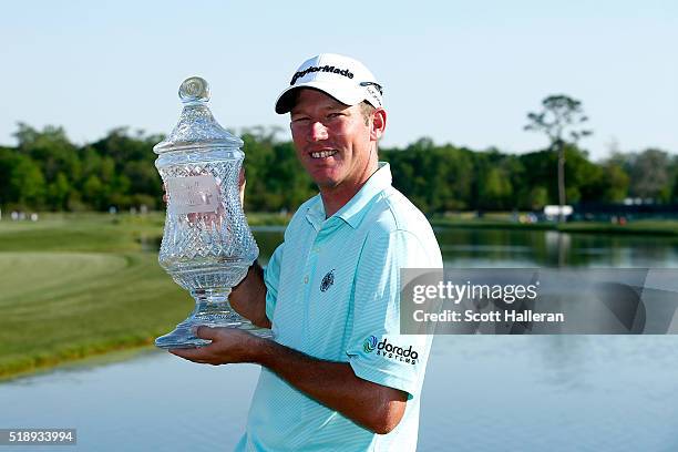 Jim Herman of the United States poses with the trophy after his victory at the Shell Houston Open at the Golf Club of Houston on April 3, 2016 in...