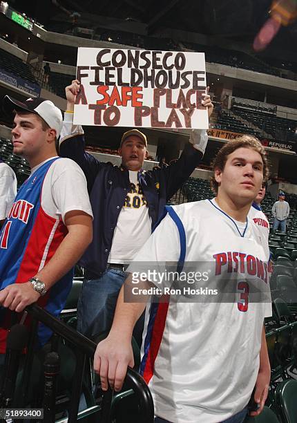 Indiana Pacer fan relays his message to a few Detroit Pistons fan prior to the start of the Pistons vs Pacers game at Conseco Fieldhouse on December...